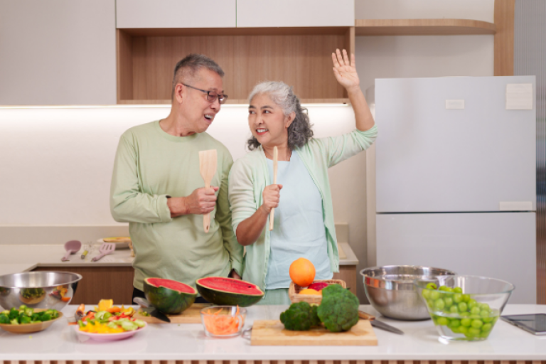 Older adult couple preparing healthy foods