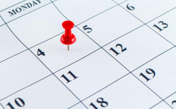 Photo of a calendar with a pushpin